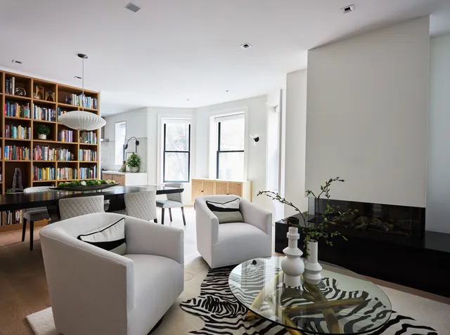 a view of a living room and dining room