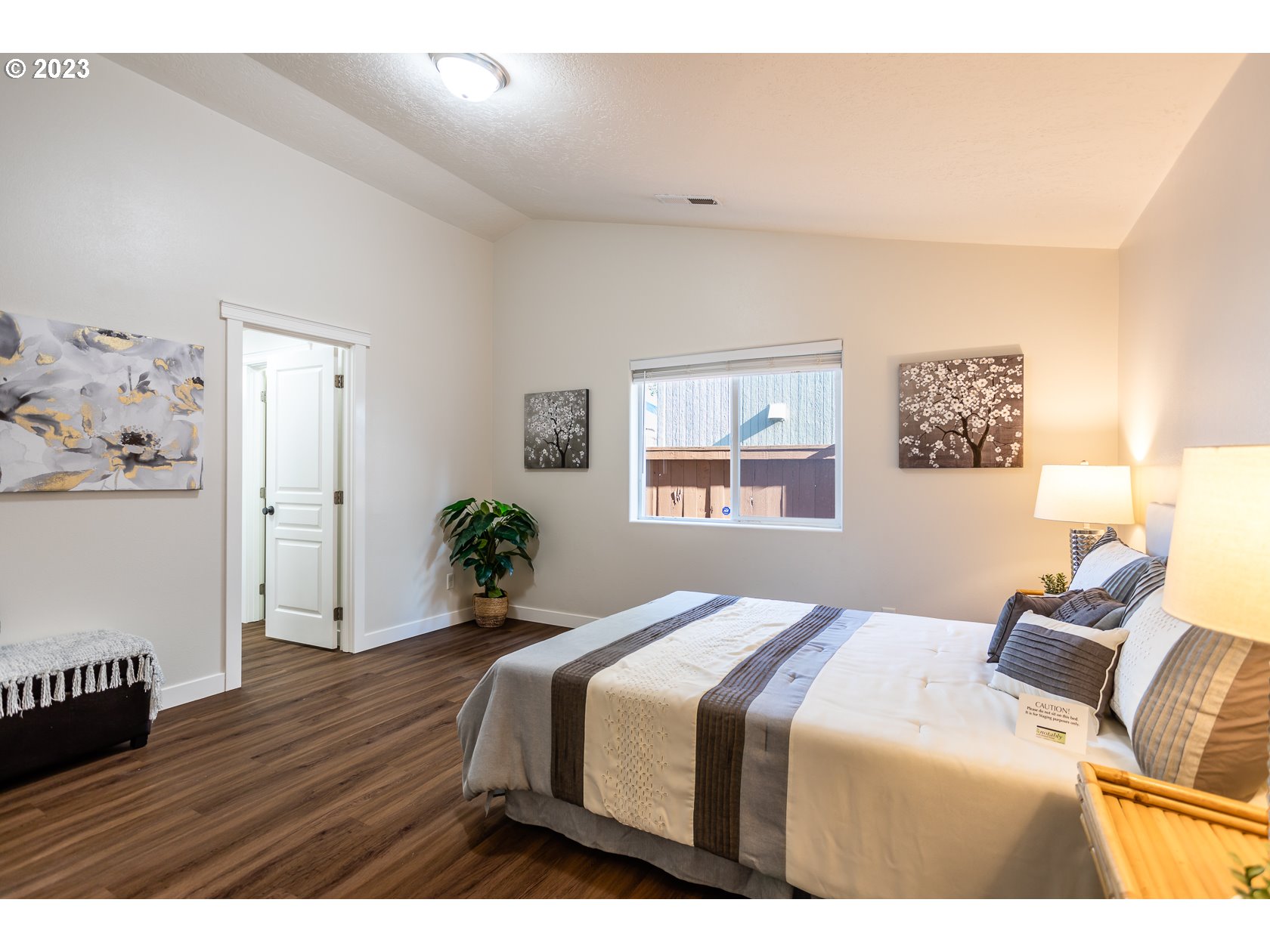 4840 Holly Street Springfield, OR 97478 - Photo 17 of 27 a bedroom with a bed and wooden floor