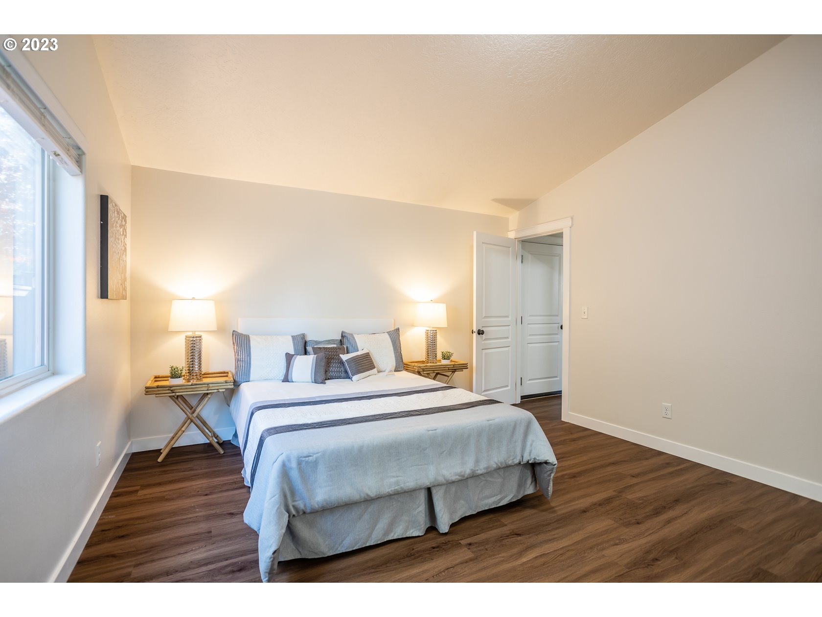 4840 Holly Street Springfield, OR 97478 - Photo 18 of 27 a bedroom with a bed and wooden floor