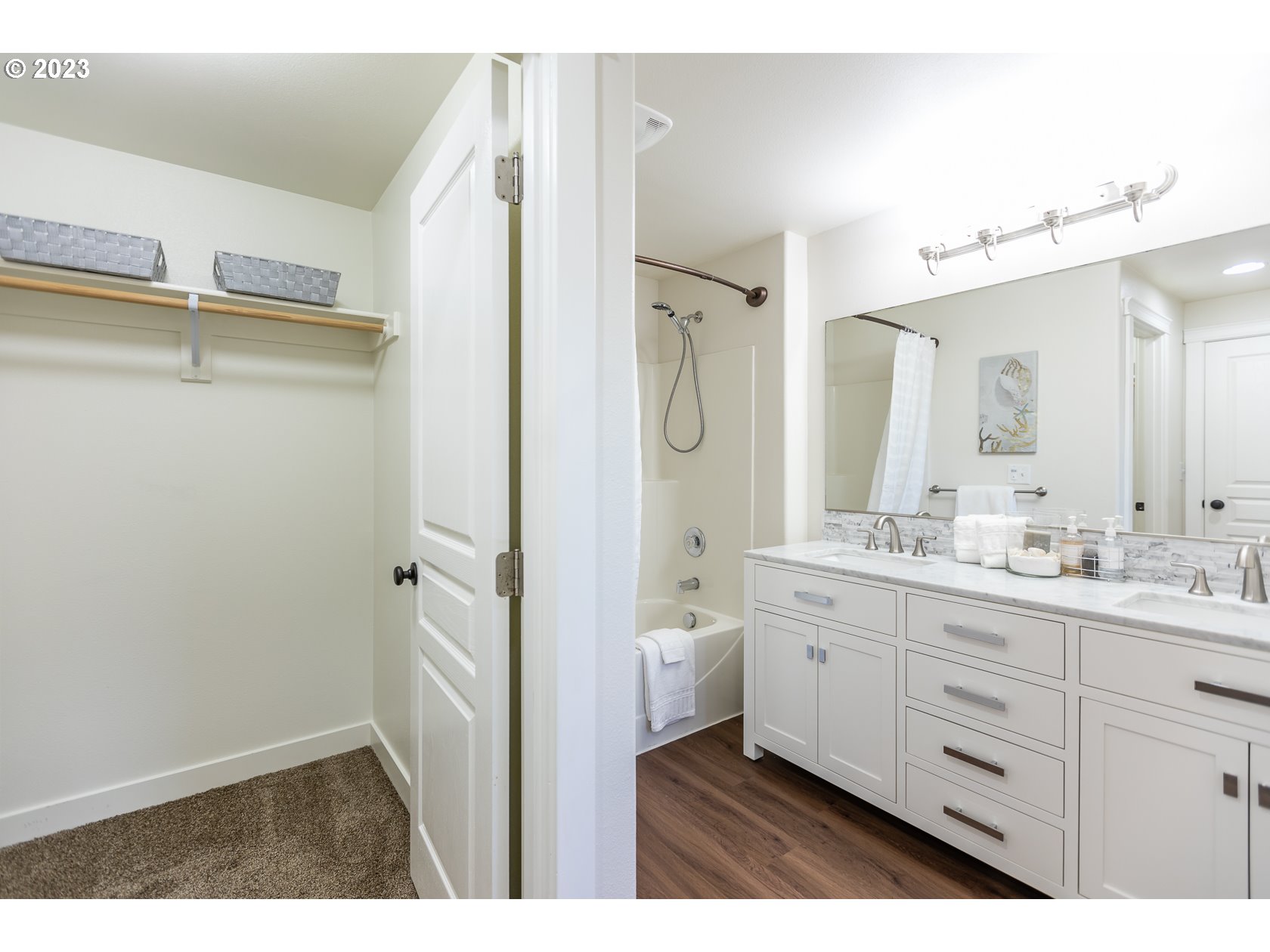 4840 Holly Street Springfield, OR 97478 - Photo 20 of 27 a bathroom with a double vanity sink a mirror and a bathtub