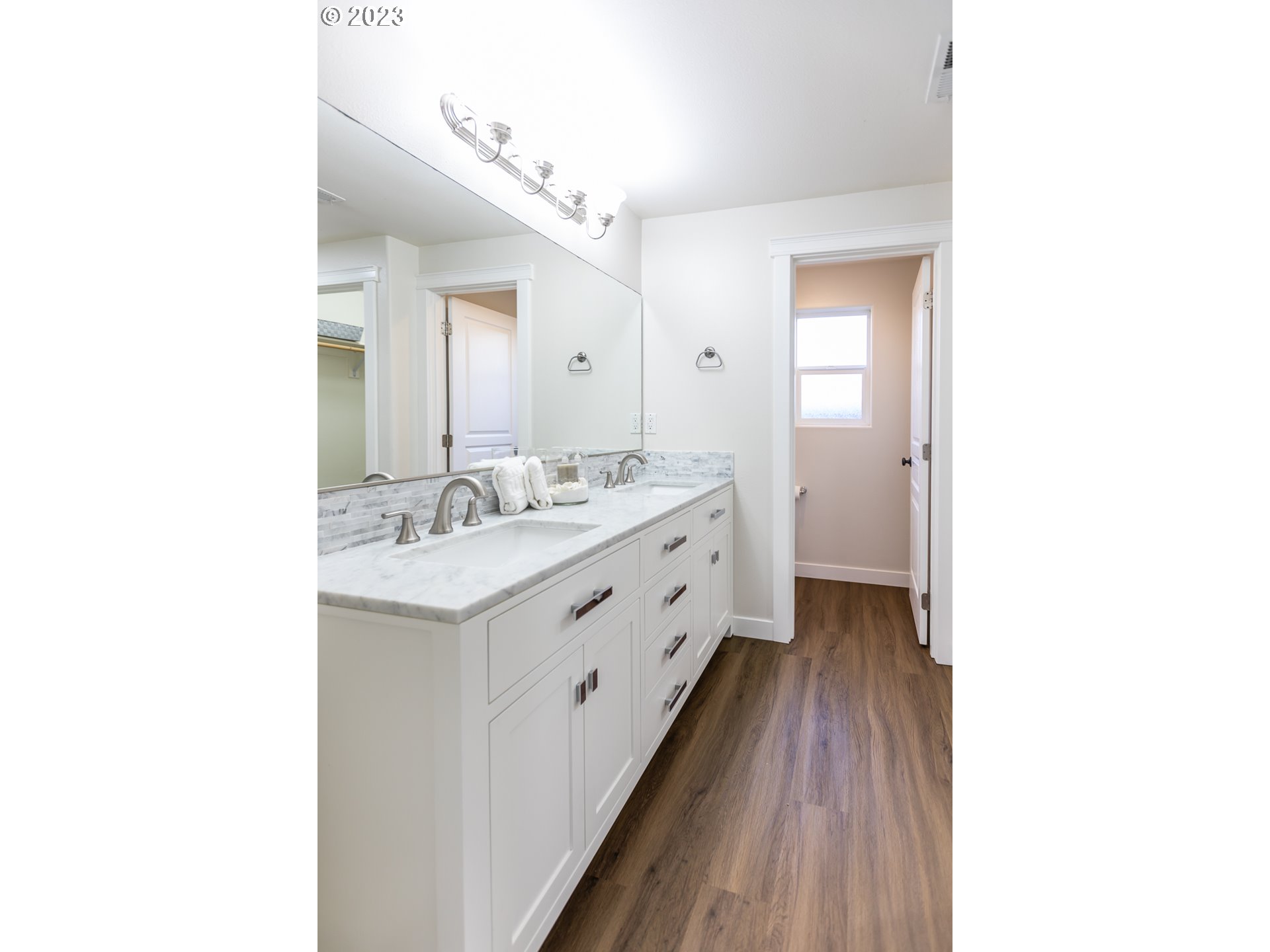 4840 Holly Street Springfield, OR 97478 - Photo 23 of 27 a spacious bathroom with a double vanity sink and a mirror