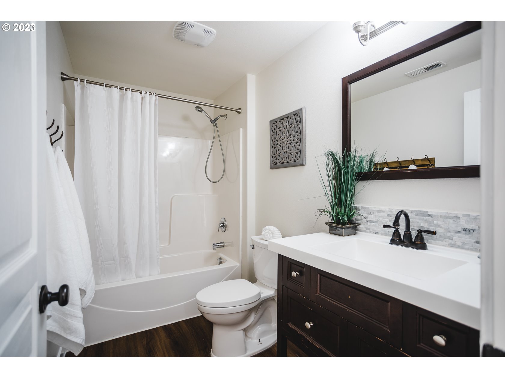 4840 Holly Street Springfield, OR 97478 - Photo 6 of 27 a bathroom with a sink a toilet and a mirror