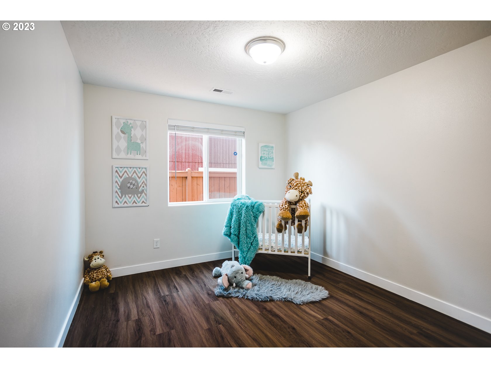 4840 Holly Street Springfield, OR 97478 - Photo 7 of 27 a view of a livingroom with wooden floor and a window