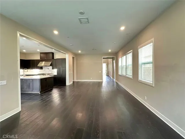 a open kitchen with a sink dishwasher stove and cabinets