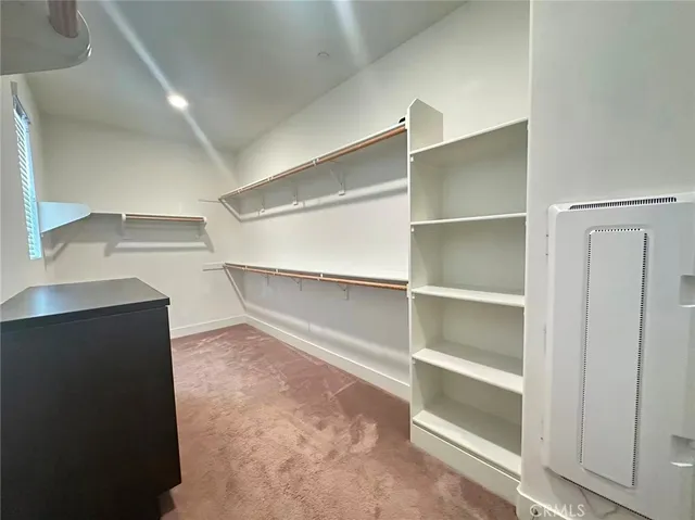 a view of an empty walk in closet