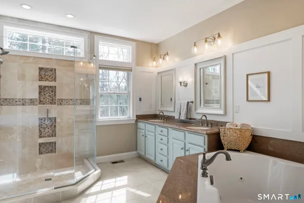 a hall with a sink and a mirror