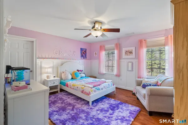 a bedroom with a bed and a couch