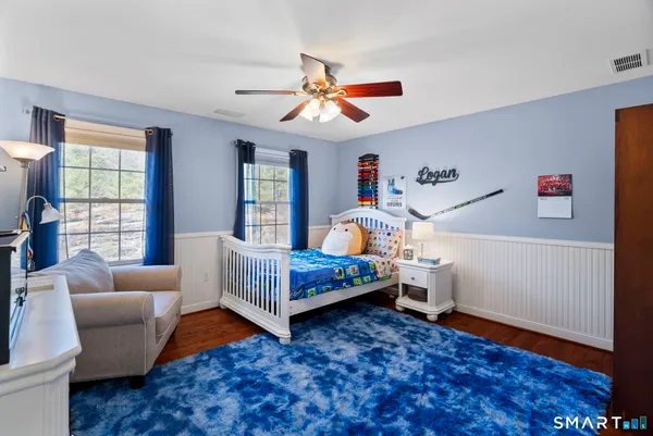 a bedroom with furniture and a window