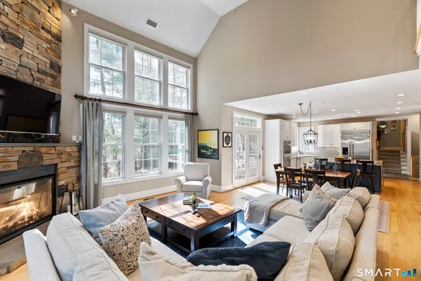 a living room with fireplace furniture and a flat screen tv