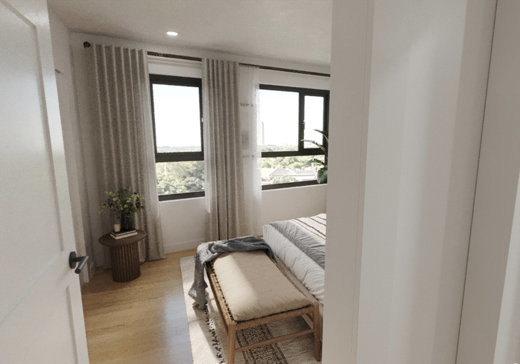 270 Talbot Avenue, Unit 302 Boston, MA 02124 - Photo 12 of 13 a bedroom with a bed and a window