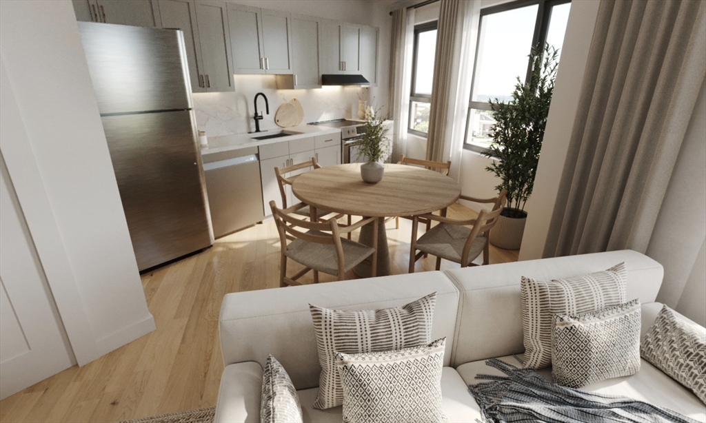 270 Talbot Avenue, Unit 302 Boston, MA 02124 - Photo 2 of 13 a living room with furniture and a refrigerator