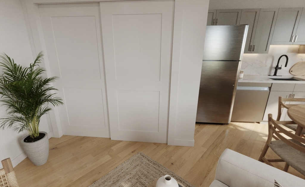 270 Talbot Avenue, Unit 302 Boston, MA 02124 - Photo 3 of 13 a view of a kitchen with refrigerator and sink