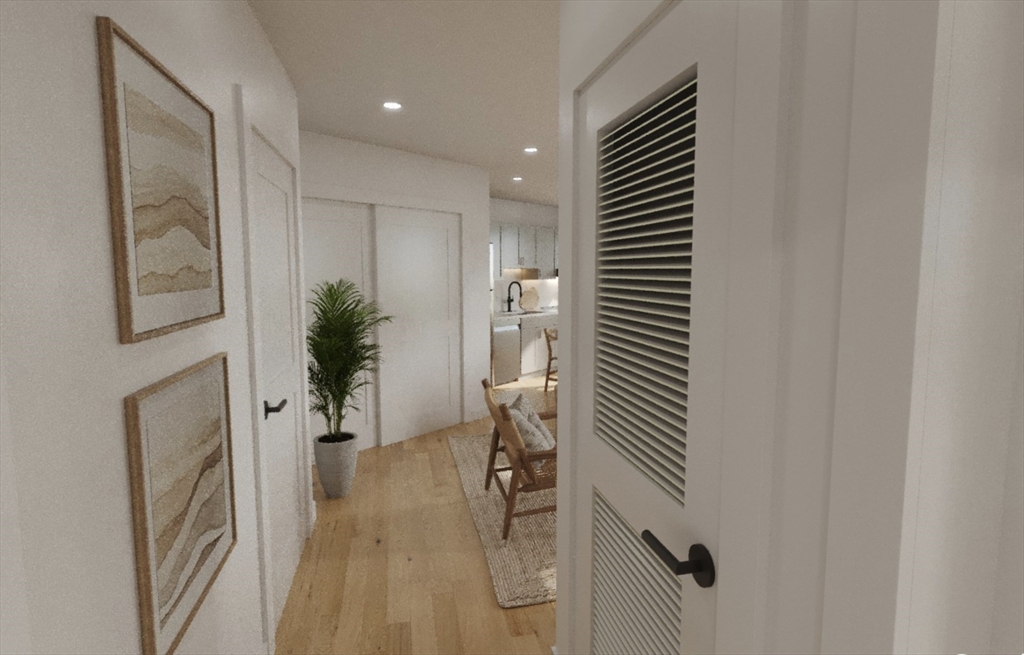 270 Talbot Avenue, Unit 302 Boston, MA 02124 - Photo 6 of 13 a hallway with a potted plant on the wall