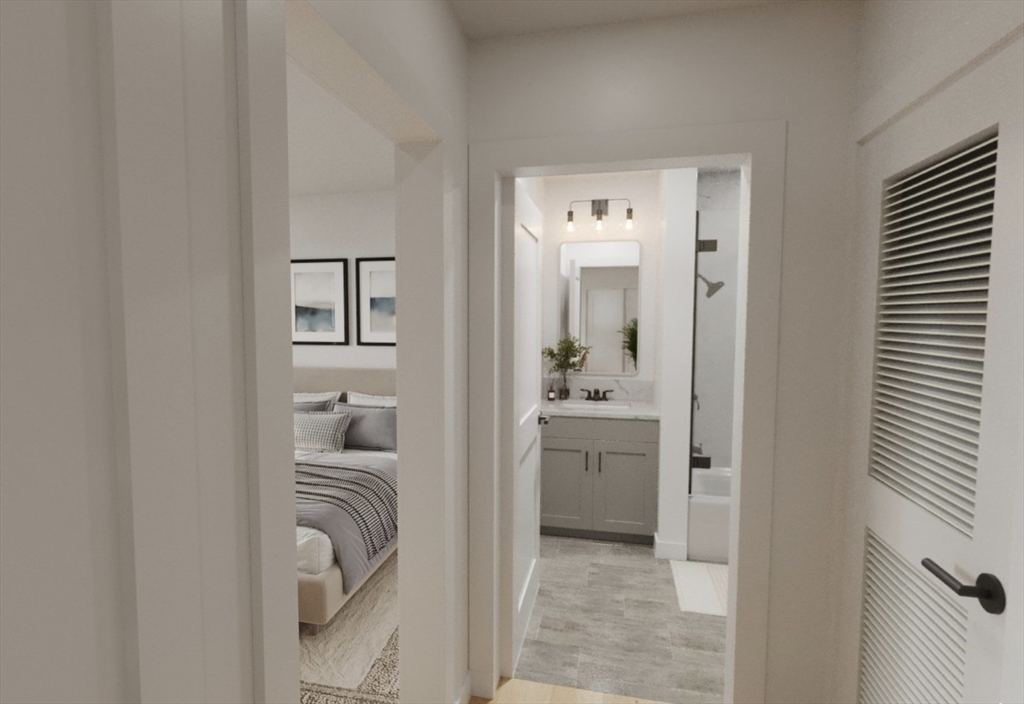 270 Talbot Avenue, Unit 302 Boston, MA 02124 - Photo 7 of 13 a en suite bathroom with a granite countertop sink and a mirror