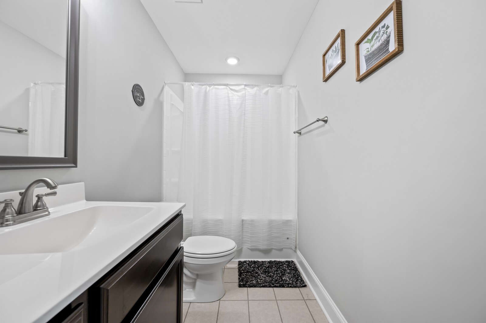 246 King Road Clarksville, TN 37042 - Photo 16 of 21 a bathroom with a sink a toilet a shower and a mirror