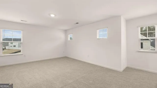 an aerial view of residential house with outdoor space and swimming pool