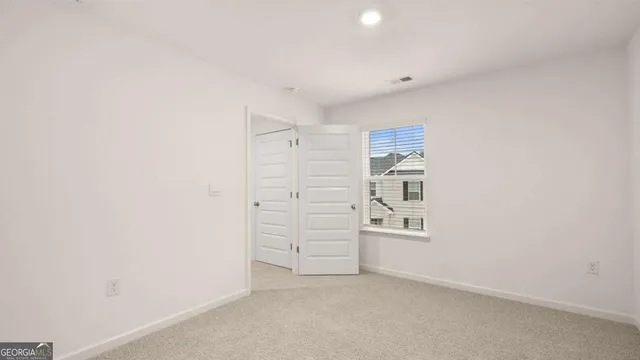 a front view of a house with swimming pool and porch