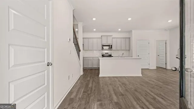 a view of kitchen with wooden floor
