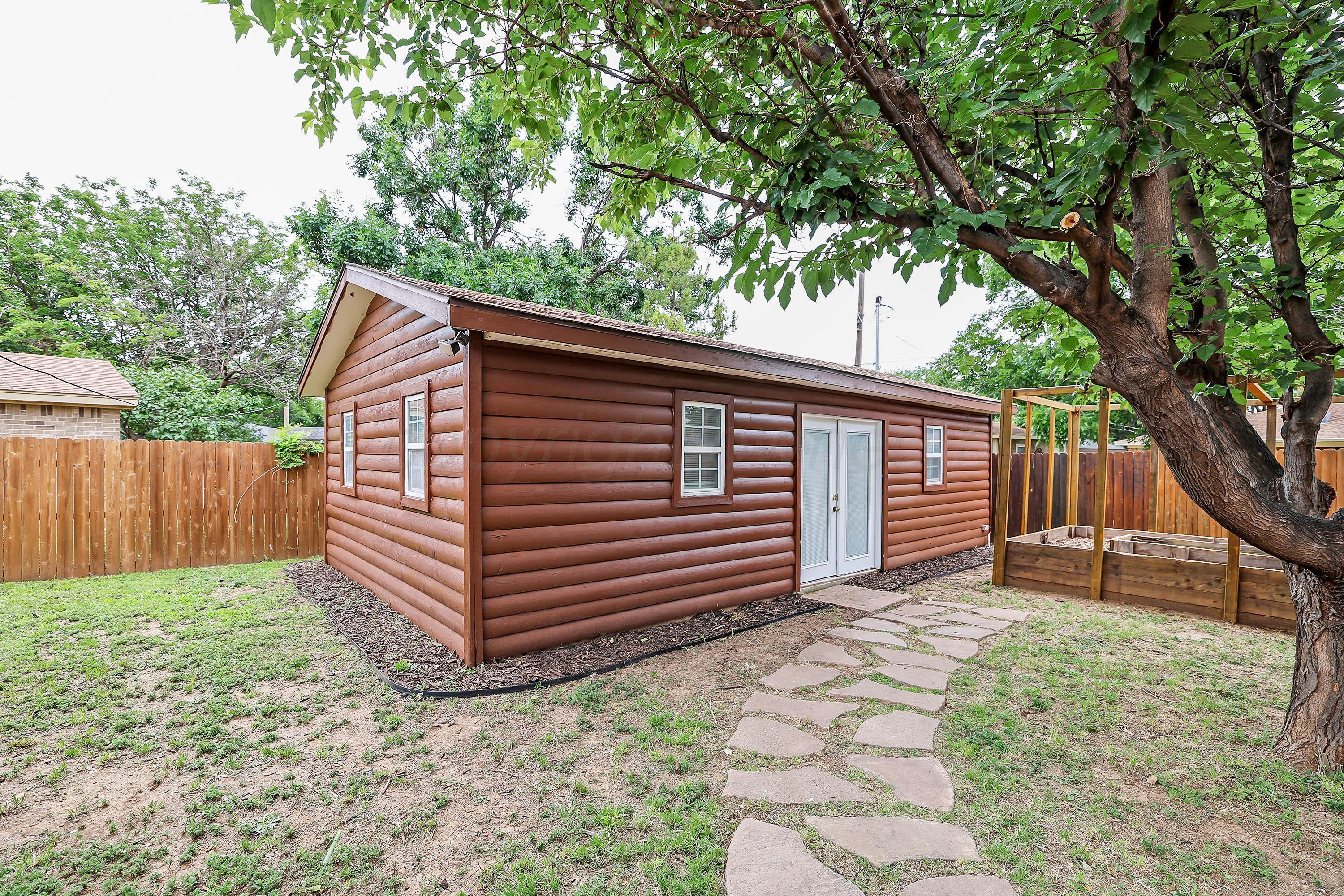7426 Jameson Drive Amarillo, TX 79121 - Photo 36 of 38 a view of a house with a yard and wooden fence