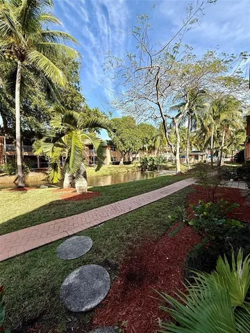 a view of yard with patio