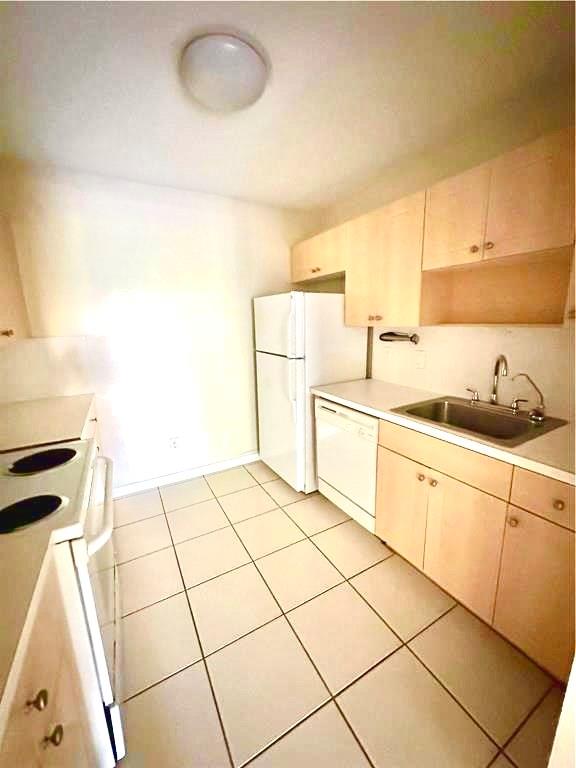 760 Southeast 2nd Avenue, Unit D112 Deerfield Beach, FL 33441 - Photo 3 of 7 a kitchen with a sink cabinets and appliances