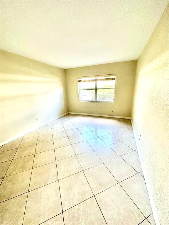 760 Southeast 2nd Avenue, Unit D112 Deerfield Beach, FL 33441 - Photo 7 of 7 a view of an empty room and window