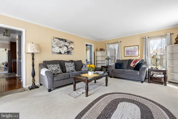 a kitchen with granite countertop wooden cabinets stainless steel appliances a sink and a window