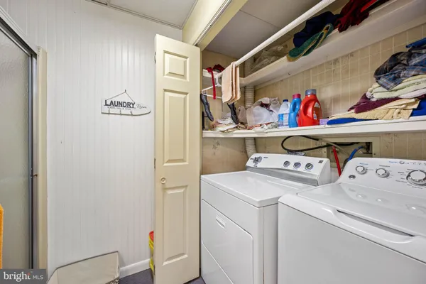 a bedroom with a bed and a flat tv screen