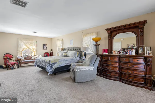 a living room with furniture or couch and a large window