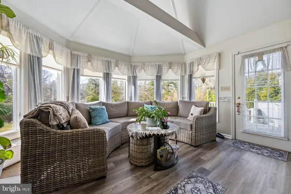 a view of a chairs and a table in the balcony