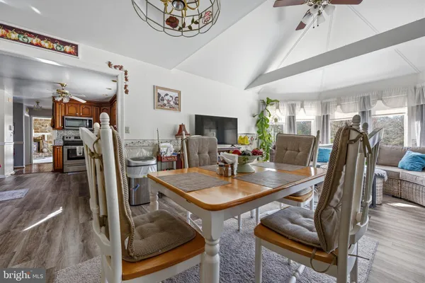 a view of balcony with wooden floor and fence
