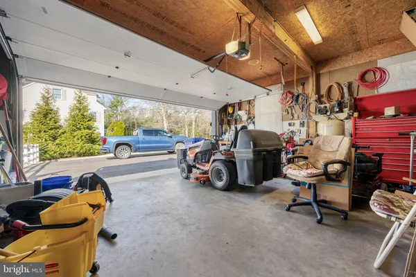 swimming pool view with a seating space