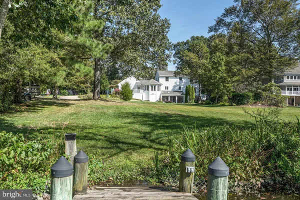 a backyard of a house with lots of green space