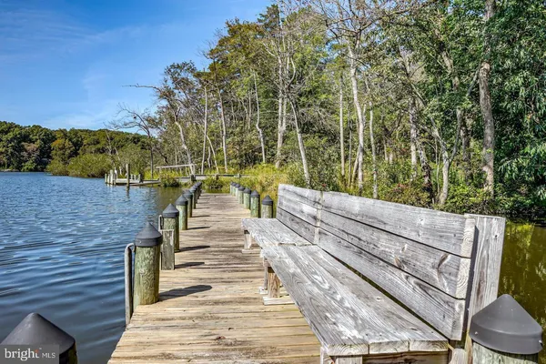 a view of a balcony with two chairs