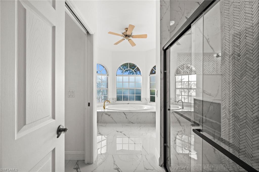 3972 Ruxton Road Naples, FL 34116 - Photo 18 of 41 a view of a hallway with windows