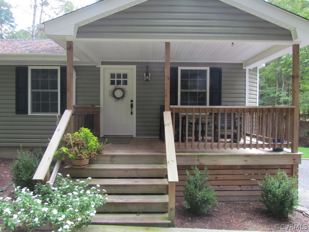 19251 Tomlin Hill Drive Zuni, VA 23898 - Photo 1 of 26 a view of porch with seating space