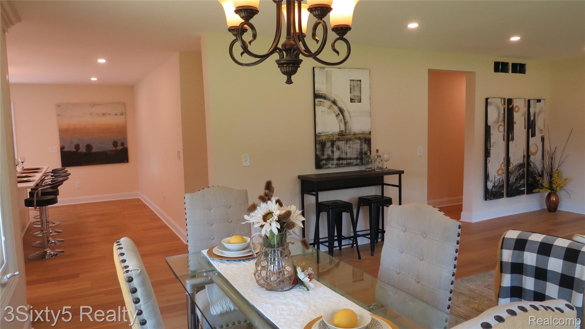 16558 Haggerty Road Belleville, MI 48111 - Photo 9 of 40 Dining area featuring a decorative chandelier and light wood-finish flooring