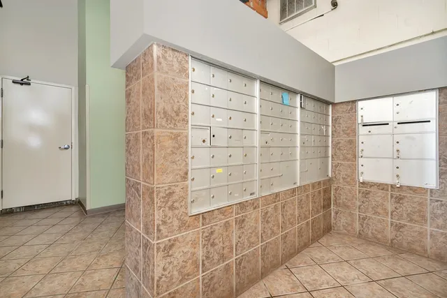 a view of walk in closet and bathroom