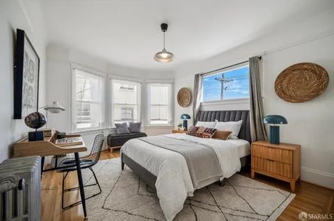 a bedroom with furniture and a bed