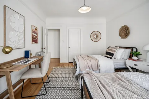 a bedroom with bed and a window