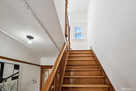 a kitchen with stainless steel appliances granite countertop wooden cabinets stove top oven and sink