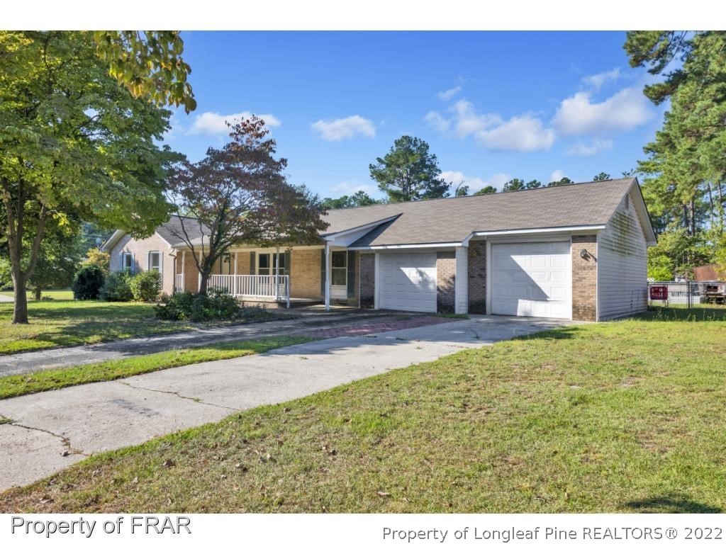 901 Ruton Court Fayetteville, NC 28303 - Photo 1 of 7 a view of a house with yard and tree s