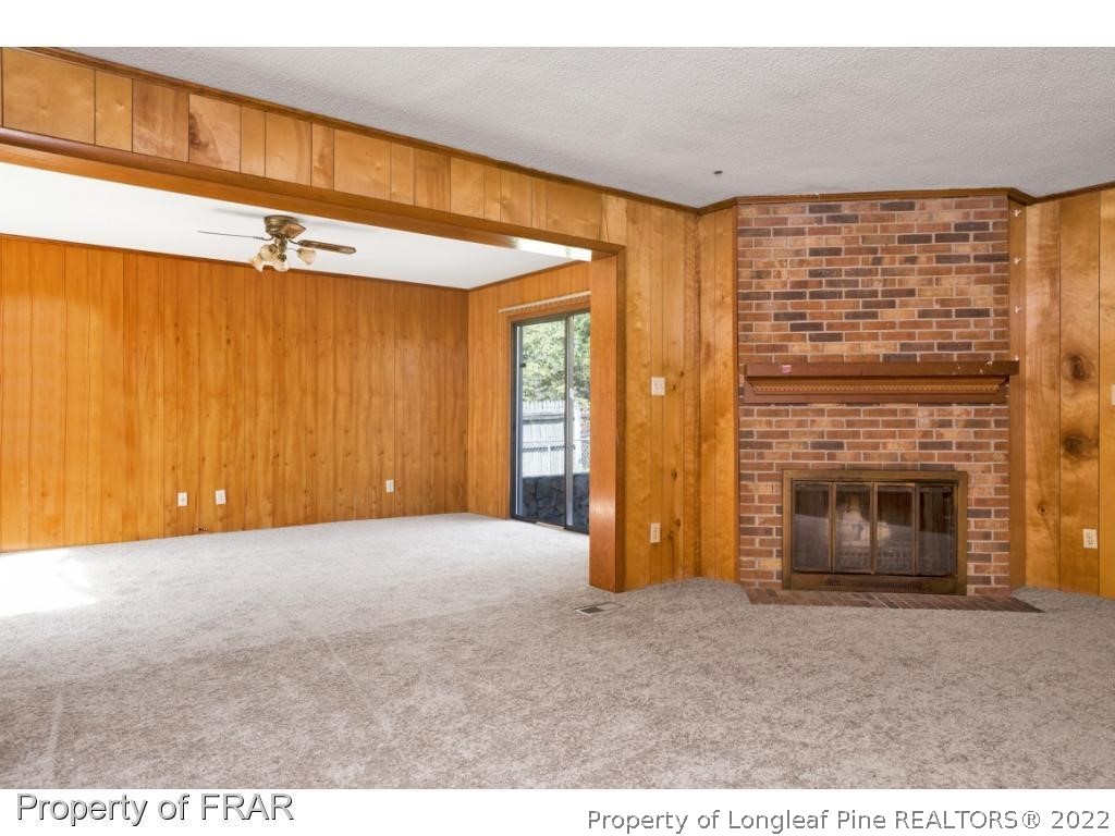 901 Ruton Court Fayetteville, NC 28303 - Photo 2 of 7 a view of an empty room with a fireplace