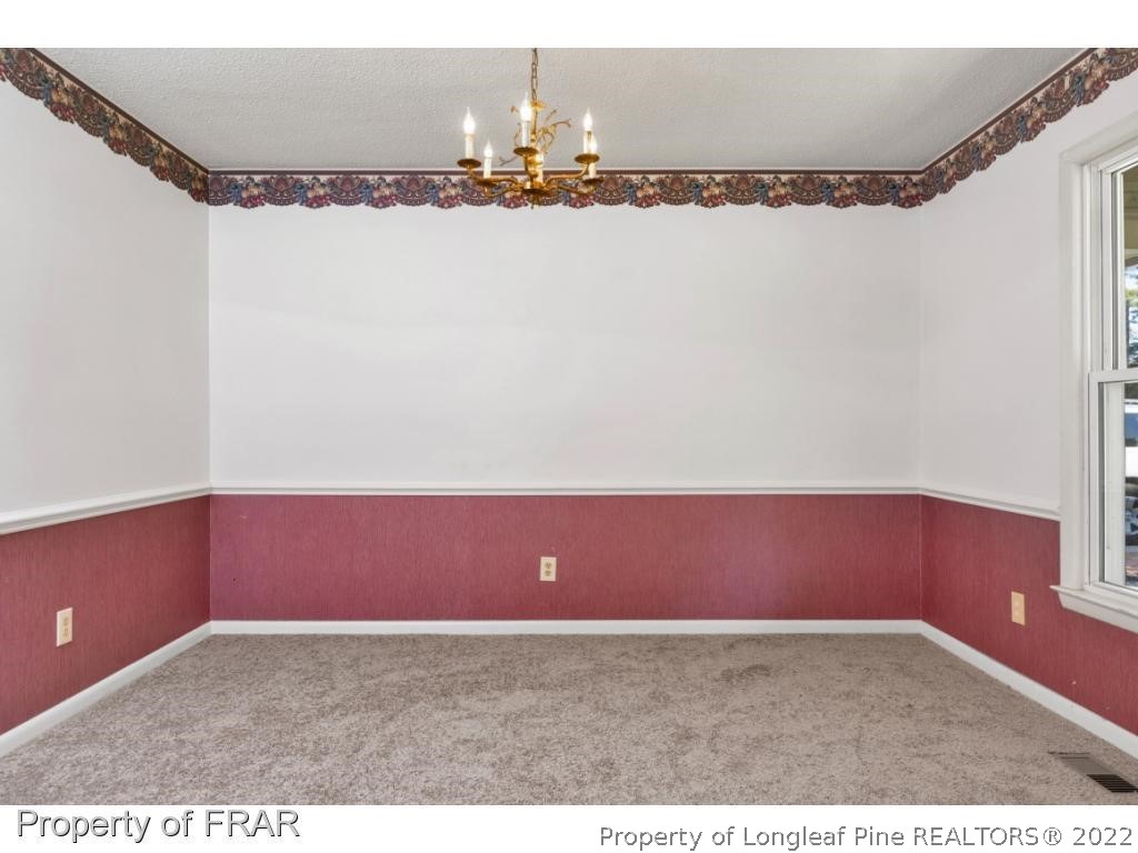 901 Ruton Court Fayetteville, NC 28303 - Photo 3 of 7 a view of a an empty room and window