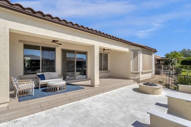 a building outdoor space with patio furniture and potted plants