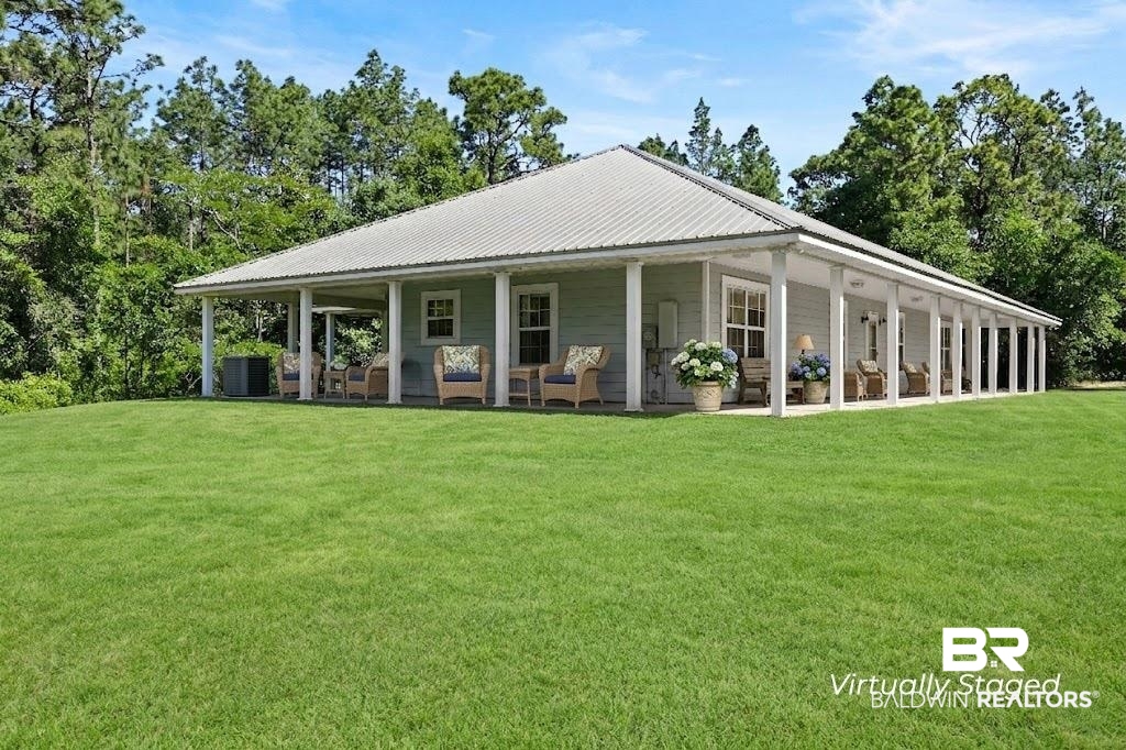 20219 Greek Cemetery Road Robertsdale, AL 36567 - Photo 2 of 41 Expansive green lawn surrounding a residence with light-colored siding