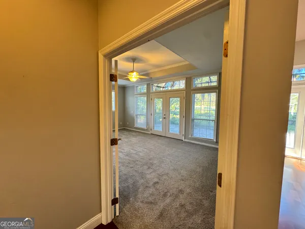 a view of an empty room with a window
