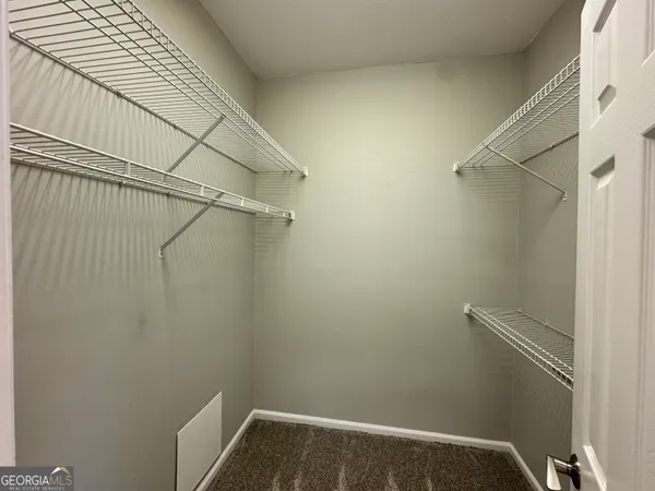 a spacious bathroom with a granite countertop tub sink and mirror