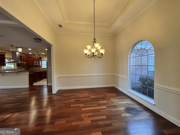 a view of kitchen with wooden floor