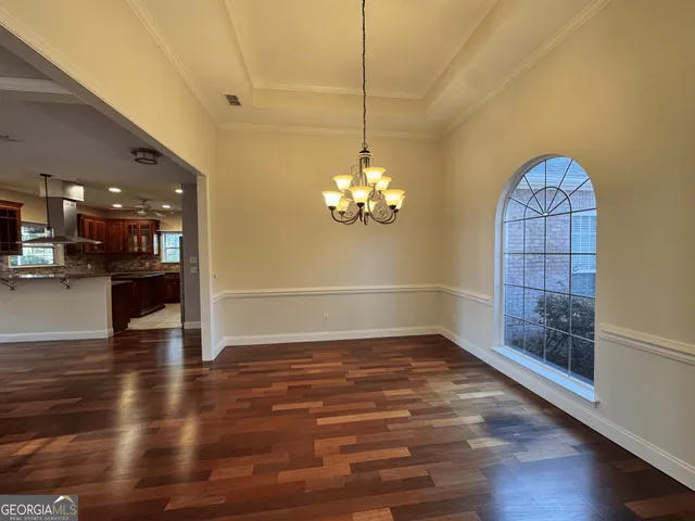 a view of kitchen with wooden floor